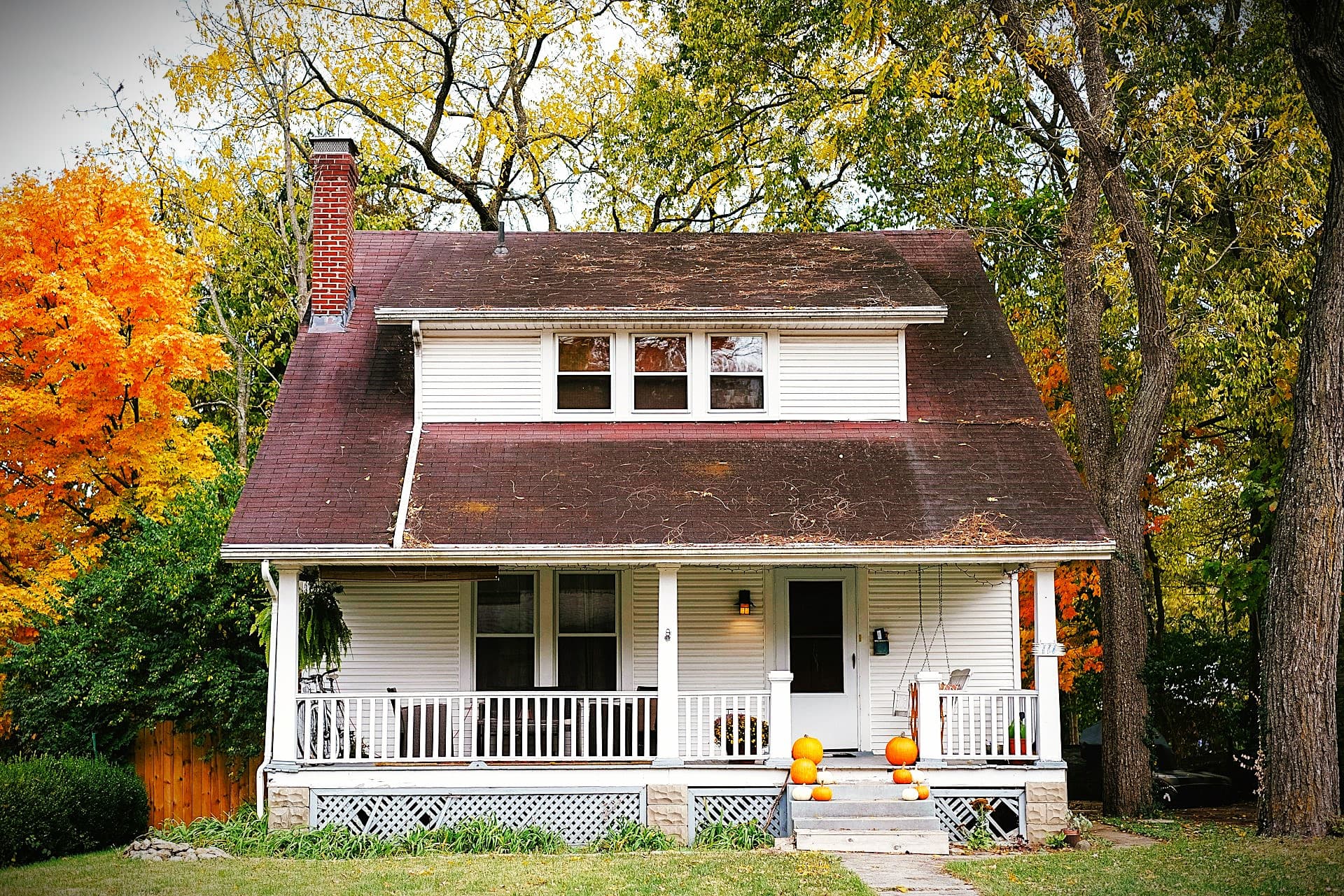 Happy family in front of a home